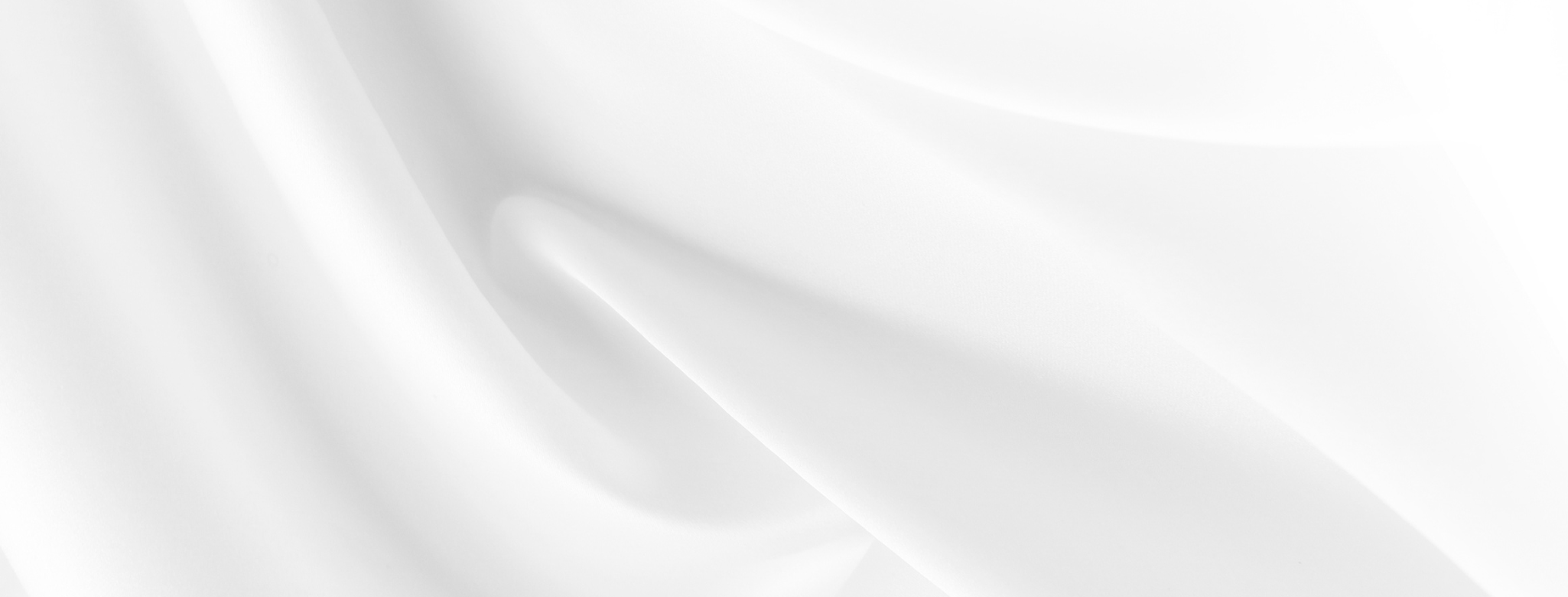 An elegant white photo that resembles a sheet blowing the breeze.